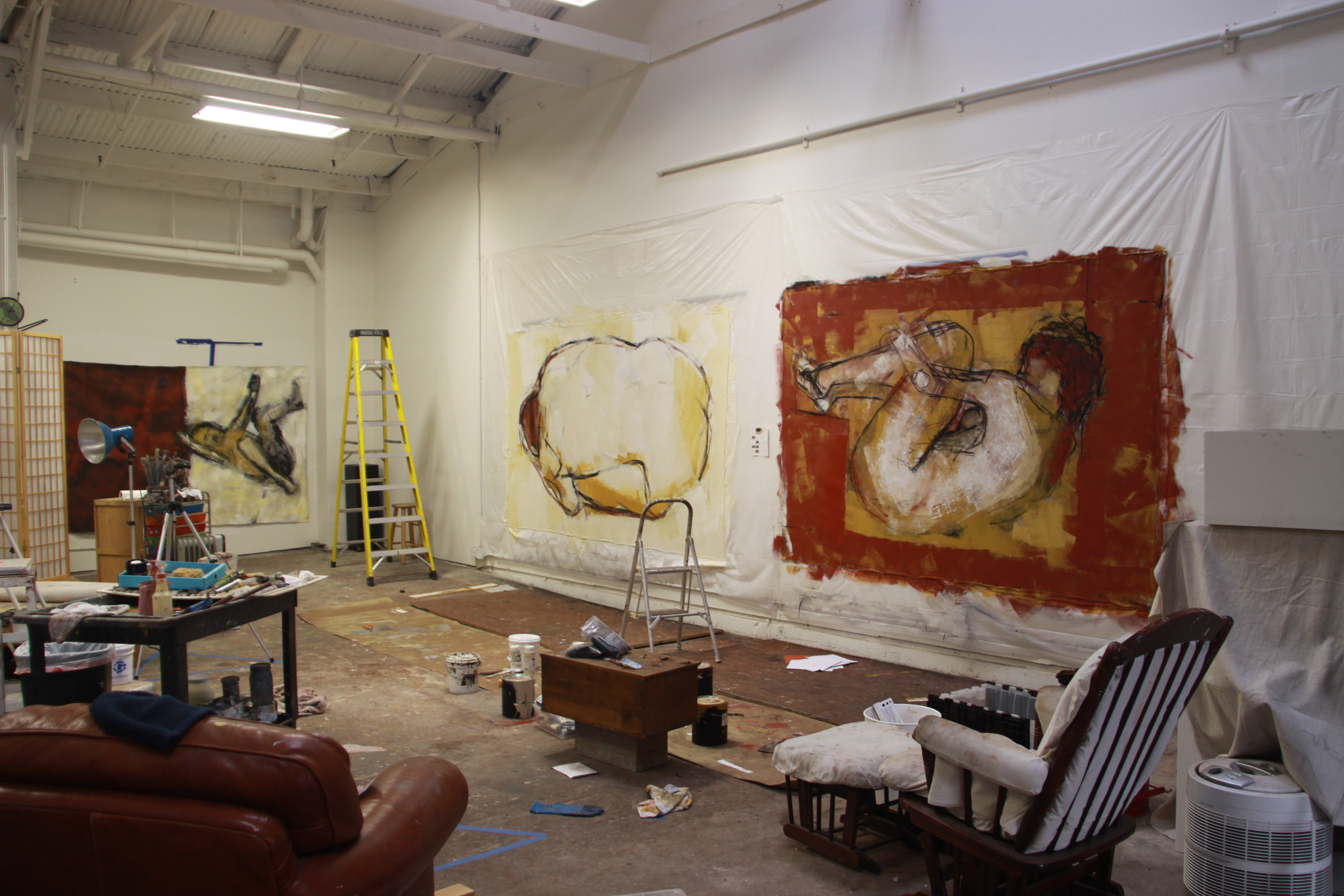 Large-scale paintings hanging in the studio of Barbara Downs